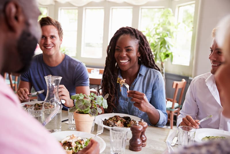 A group of people eating a meal together