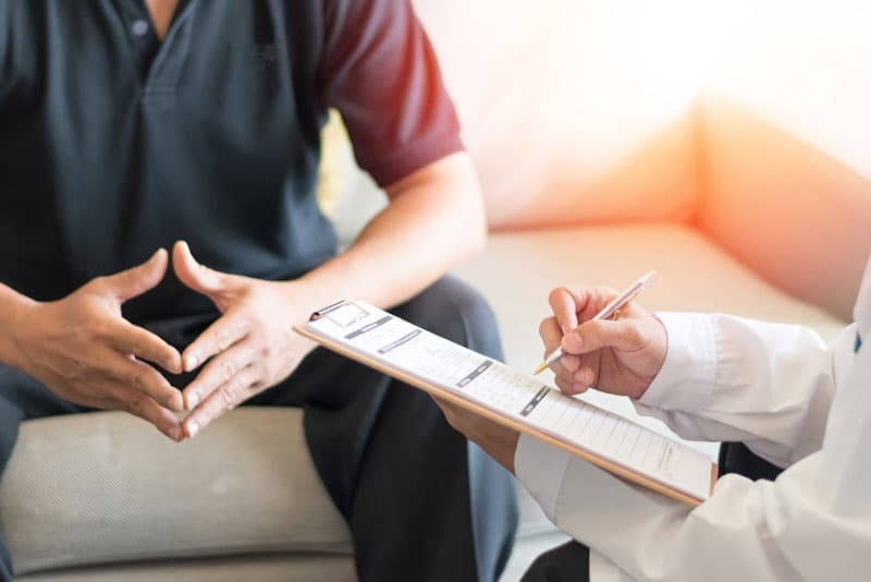 A man consulting a doctor for health advice