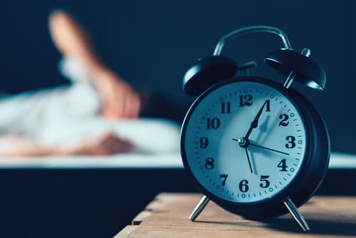 Alarm clock on a bedside cabinet