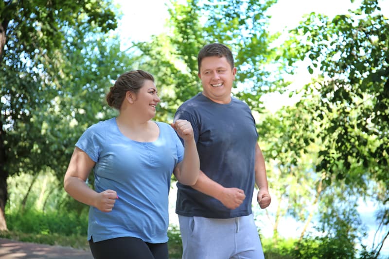 heterosexual couple running together