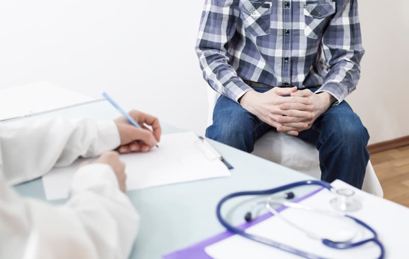 A doctor issuing a prescription for Levitra