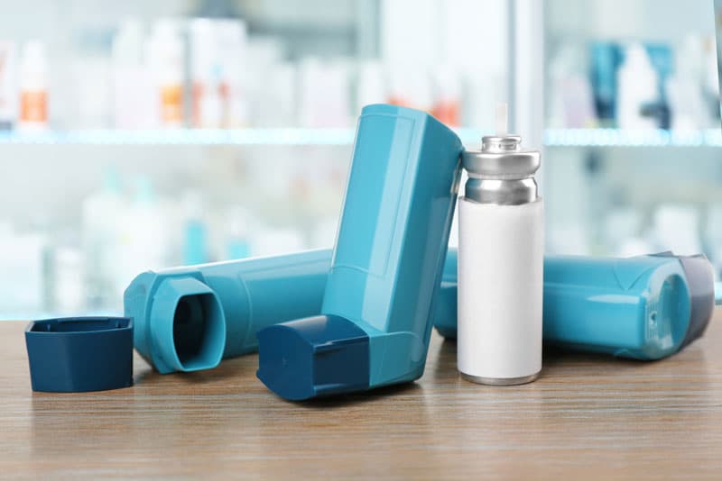 Multiple Ventolin inhalers on the table