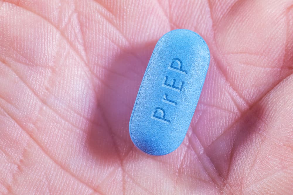 PrEP tablet in the palm of a hand