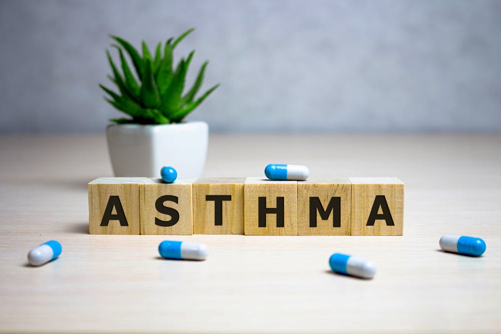 A series of letter blocks spelling out the word 'asthma'