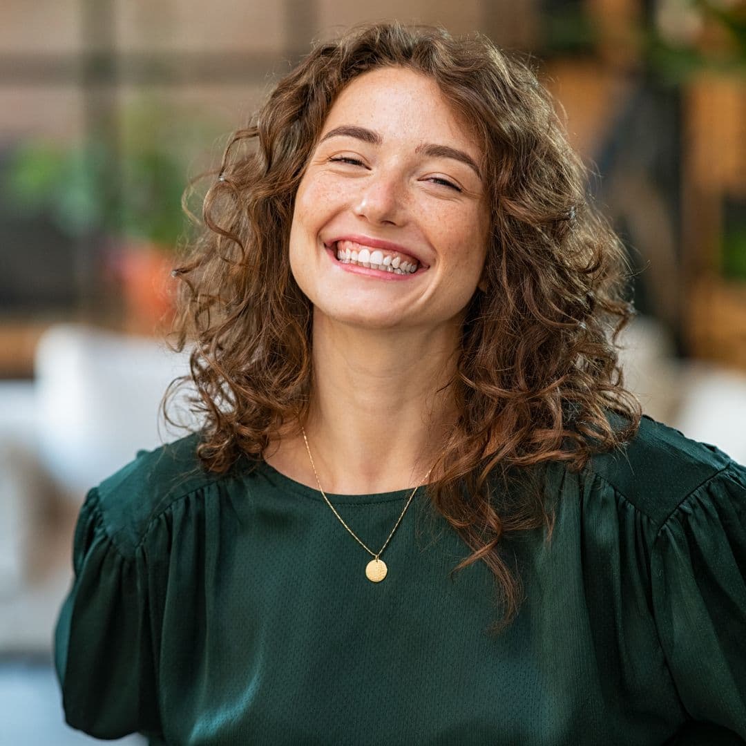 Lady smiling due to how effective the coil has been for her as a contraceptive method