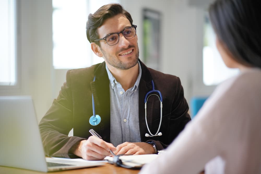 A GP speaking to a patient