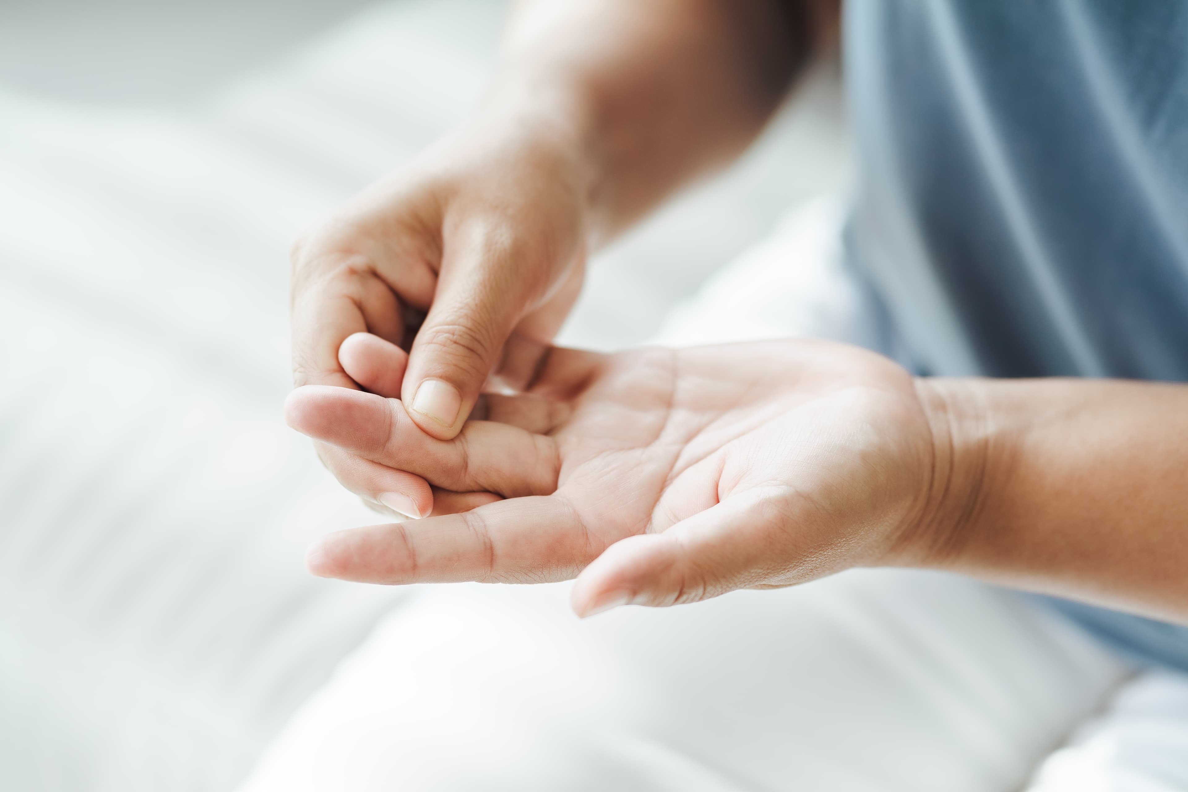 A person with gout in their fingers